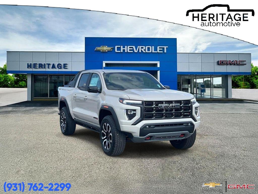 2026 GMC Canyon AT4 in Coastal Dune — front three-quarter view