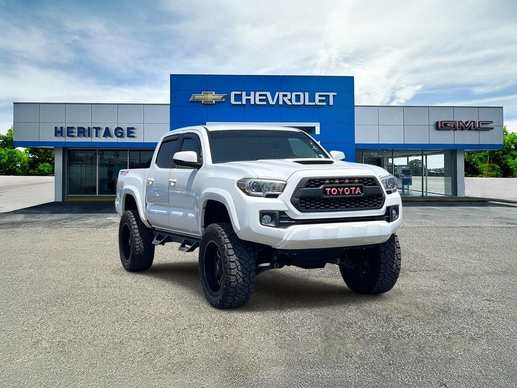 2016 Toyota Tacoma TRD Sport in White — front three-quarter view